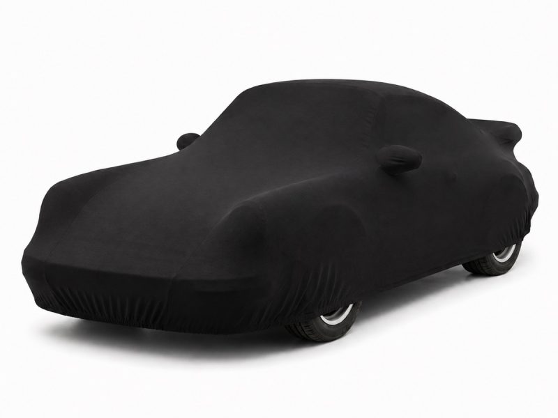 Housse intérieure Jersey Noir pour Porsche 911 Turbo (930) Housse de protection intérieure Jersey noire sur mesure posée sur une Porsche 911 Turbo (930), vue avant 3/4