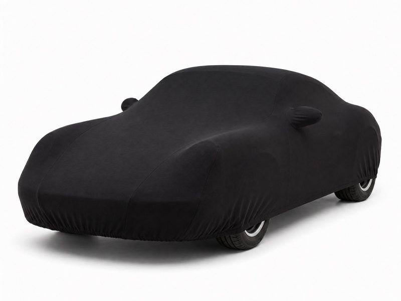 Housse de protection intérieure Jersey noire sur mesure posée sur une Porsche Cayman 987, vue avant 3/4