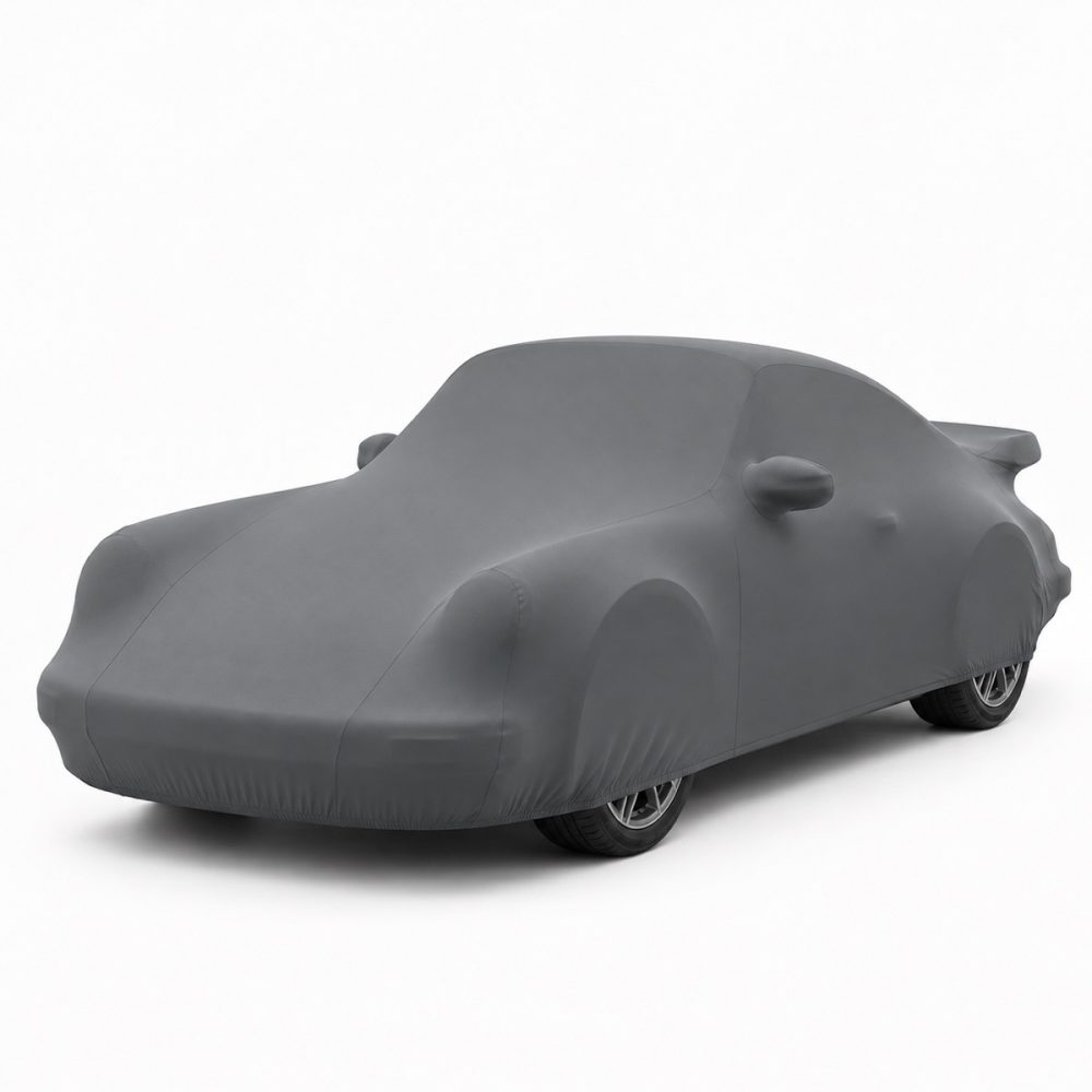 Housse intérieure Lycra Gris anthracite pour Porsche 911 SC et Carrera 3.2 « Turbo-Look » Housse de protection intérieure Lycra gris anthracite sur mesure posée sur une Porsche 911 SC et Carrera 3.2 « Turbo-Look », vue avant 3/4