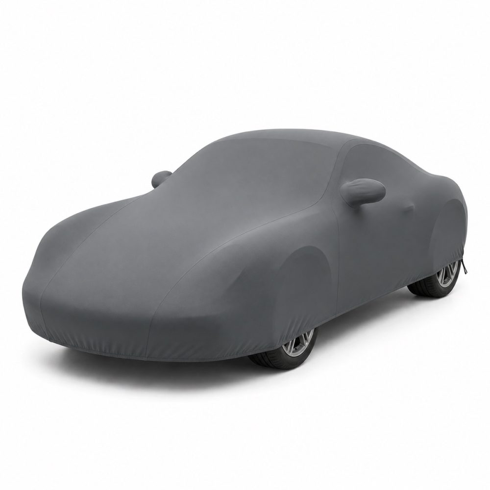 Housse intérieure Lycra Gris anthracite pour Porsche Cayman (987c) Housse de protection intérieure Lycra gris anthracite sur mesure posée sur une Porsche Cayman 987c, vue avant 3/4